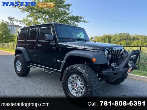 Used 2014 Jeep Wrangler Unlimited Rubicon w/ Dual Top Group AWD/4WD image 1