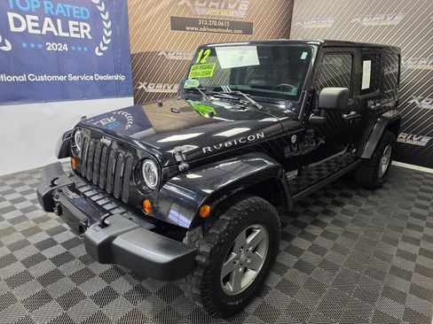 Used 2012 Jeep Wrangler Unlimited Rubicon w/ Dual Top Group AWD/4WD image 1