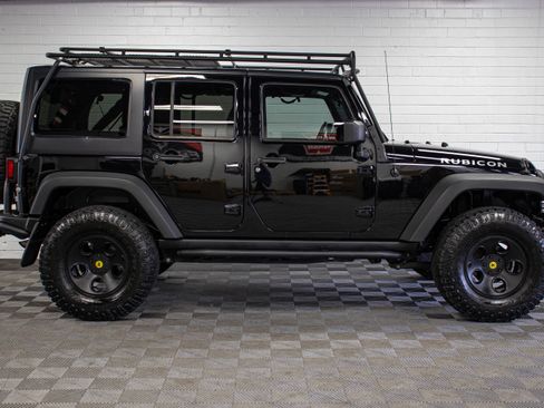 Used 2013 Jeep Wrangler Unlimited Rubicon w/ Dual Top Group AWD/4WD image 2