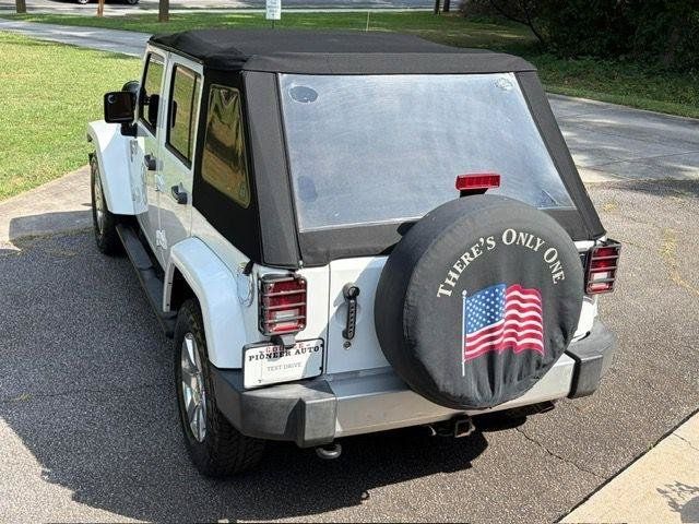 Used 2013 Jeep Wrangler Unlimited Sahara w/ Dual Top Group AWD/4WD image 32