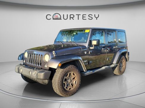Used 2014 Jeep Wrangler Unlimited Sahara w/ Connectivity Group AWD/4WD image 1