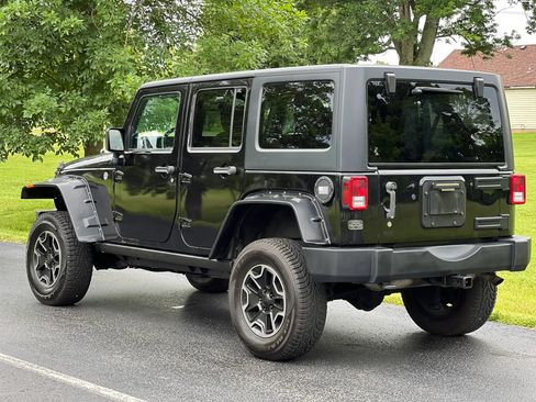 Used 2014 Jeep Wrangler Unlimited Sahara w/ Dual Top Group AWD/4WD image 7