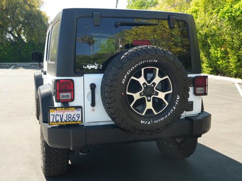 Used 2014 Jeep Wrangler Unlimited Sport w/ Mopar Black Appearance Group image 6