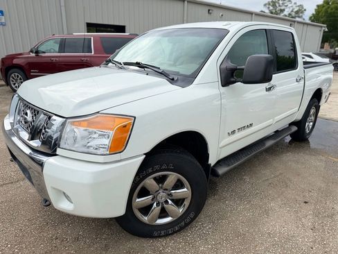 Used 2013 Nissan Titan SV w/ SV Premium Utility Pkg AWD/4WD image 1