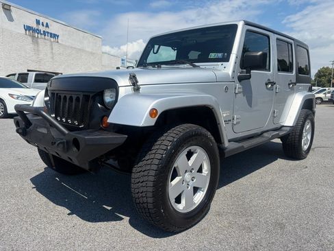 Used 2012 Jeep Wrangler Unlimited Sahara w/ Dual Top Group AWD/4WD image 1