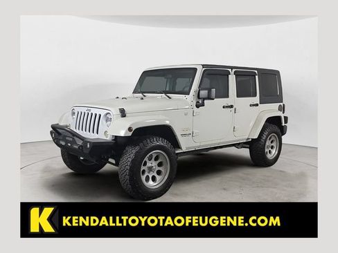 Used 2010 Jeep Wrangler Unlimited Sahara w/ Dual Top Group AWD/4WD image 1