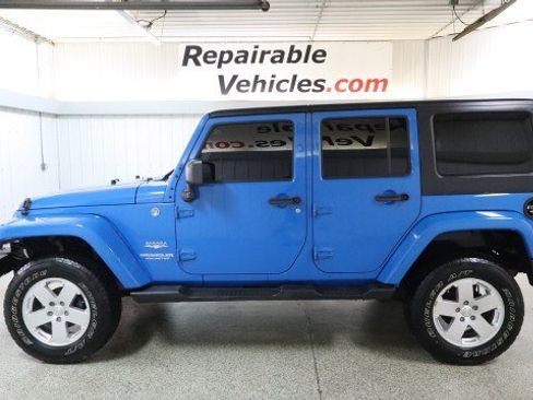 Used 2012 Jeep Wrangler Unlimited Sahara w/ Dual Top Group AWD/4WD image 1