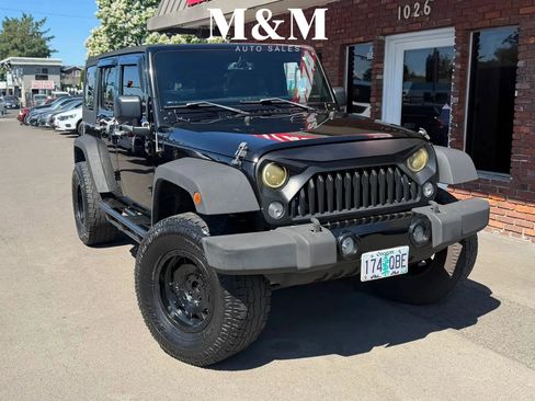 Used 2015 Jeep Wrangler Unlimited Sahara AWD/4WD image 1