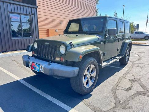 Used 2009 Jeep Wrangler Unlimited Sahara w/ Dual Top Group AWD/4WD image 1