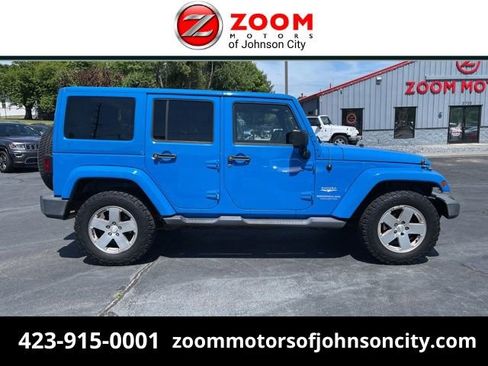 Used 2011 Jeep Wrangler Unlimited Sahara w/ Dual Top Group AWD/4WD image 1