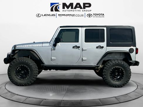 Used 2010 Jeep Wrangler Unlimited Rubicon w/ Dual Top Group image 2