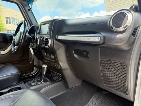 Used 2014 Jeep Wrangler Unlimited Rubicon w/ Dual Top Group AWD/4WD image 24