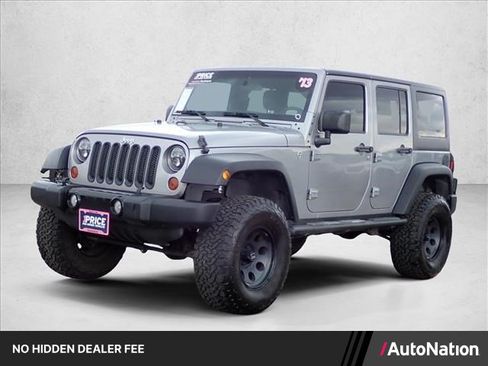 Used 2013 Jeep Wrangler Unlimited Sport w/ Mopar Black Appearance Group AWD/4WD image 1