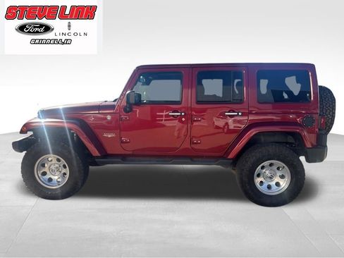 Used 2013 Jeep Wrangler Unlimited Sahara w/ Dual Top Group AWD/4WD image 1