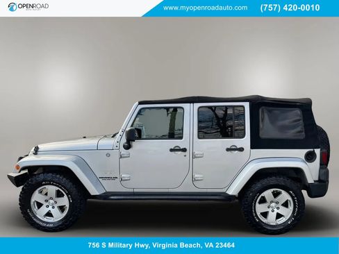 Used 2012 Jeep Wrangler Unlimited Sahara w/ Dual Top Group AWD/4WD image 1