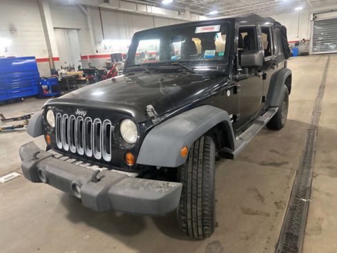 Used 2013 Jeep Wrangler Unlimited Sport image 1