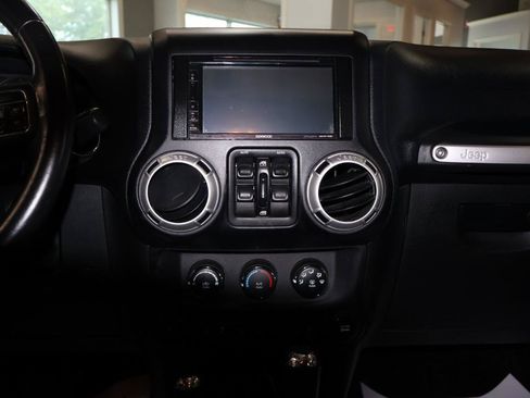 Used 2012 Jeep Wrangler Unlimited Sahara w/ Dual Top Group AWD/4WD image 16