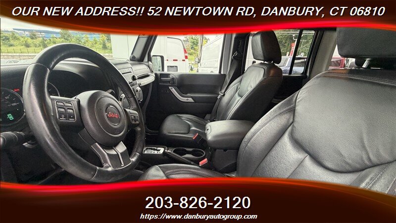 Used 2014 Jeep Wrangler Unlimited Sahara w/ Dual Top Group AWD/4WD image 11