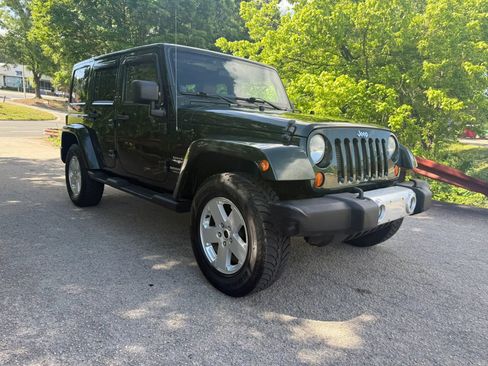 Used 2012 Jeep Wrangler Unlimited Sahara w/ Dual Top Group AWD/4WD image 3