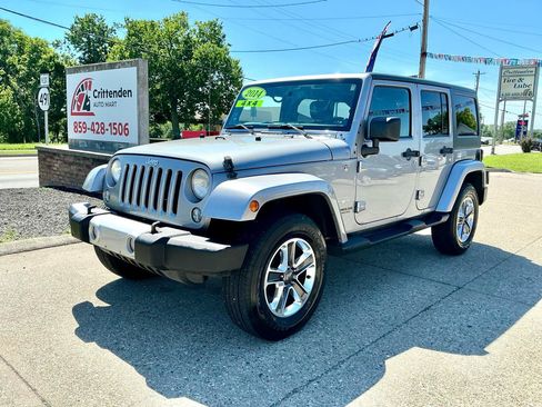Used 2014 Jeep Wrangler Unlimited Sahara AWD/4WD image 1