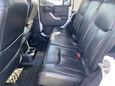 Used 2014 Jeep Wrangler Unlimited Sahara w/ Dual Top Group AWD/4WD image 14