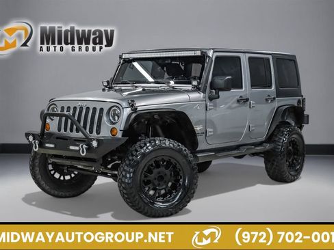 Used 2013 Jeep Wrangler Unlimited Sahara AWD/4WD image 1