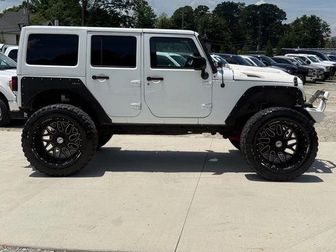 Used 2015 Jeep Wrangler Unlimited Rubicon w/ Dual Top Group AWD/4WD image 9