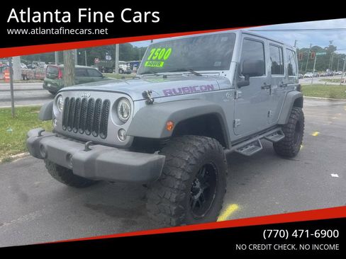 Used 2014 Jeep Wrangler Unlimited Rubicon w/ Dual Top Group AWD/4WD image 1