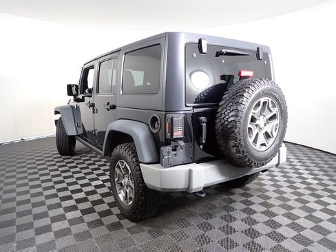 Used 2014 Jeep Wrangler Unlimited Rubicon w/ Dual Top Group AWD/4WD image 11