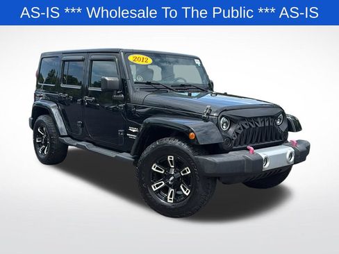 Used 2012 Jeep Wrangler Unlimited Sahara w/ Dual Top Group AWD/4WD image 1