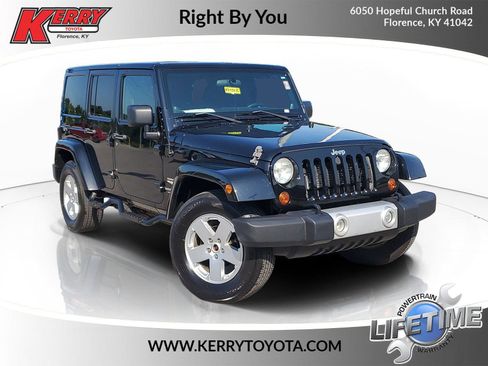 Used 2012 Jeep Wrangler Unlimited Sahara w/ Dual Top Group AWD/4WD image 1