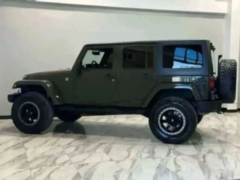 Used 2015 Jeep Wrangler Unlimited Sahara w/ Max Tow Package AWD/4WD image 29