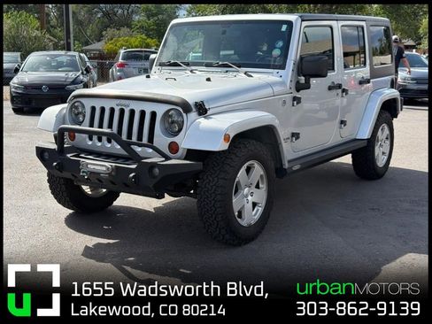 Used 2012 Jeep Wrangler Unlimited Sahara w/ Dual Top Group AWD/4WD image 1