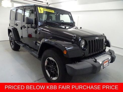 Used 2013 Jeep Wrangler Unlimited Sahara w/ Dual Top Group AWD/4WD image 1