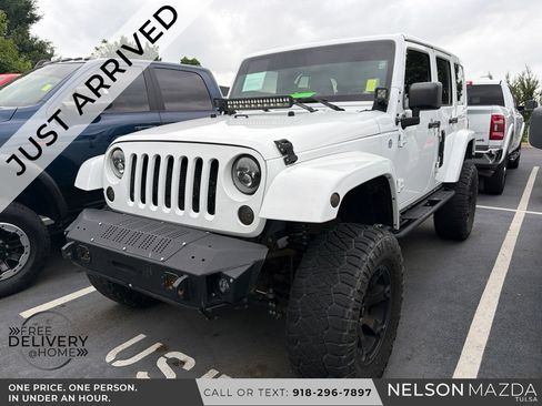 Used 2014 Jeep Wrangler Unlimited Sahara w/ Mopar Chrome Edition Group AWD/4WD image 1