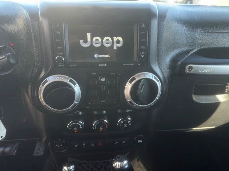 Used 2014 Jeep Wrangler Unlimited Sahara w/ Dual Top Group AWD/4WD image 23