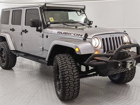 Used 2014 Jeep Wrangler Unlimited Rubicon w/ Dual Top Group AWD/4WD image 1