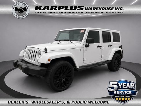 Used 2014 Jeep Wrangler Unlimited Sahara w/ Dual Top Group AWD/4WD image 1
