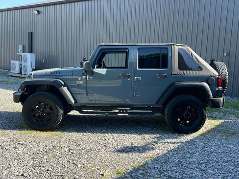 Used 2014 Jeep Wrangler Unlimited Sport w/ Dual Top Group AWD/4WD image 2