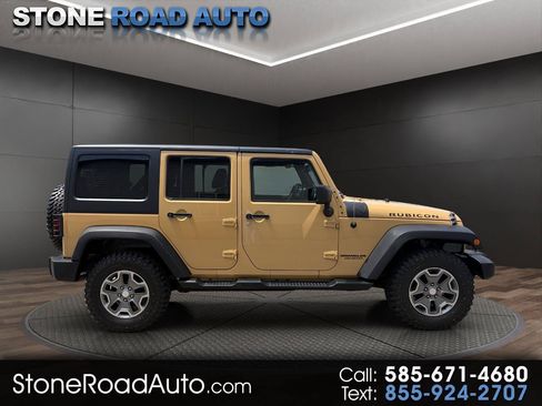 Used 2014 Jeep Wrangler Unlimited Rubicon w/ Dual Top Group AWD/4WD image 1