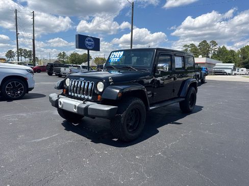Used 2013 Jeep Wrangler Unlimited Sahara w/ Mopar Chrome Edition Group AWD/4WD image 1
