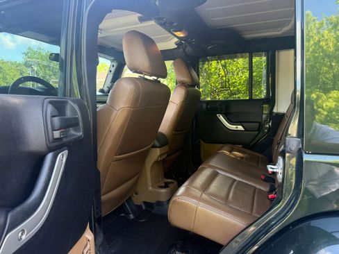Used 2012 Jeep Wrangler Unlimited Sahara w/ Dual Top Group AWD/4WD image 12