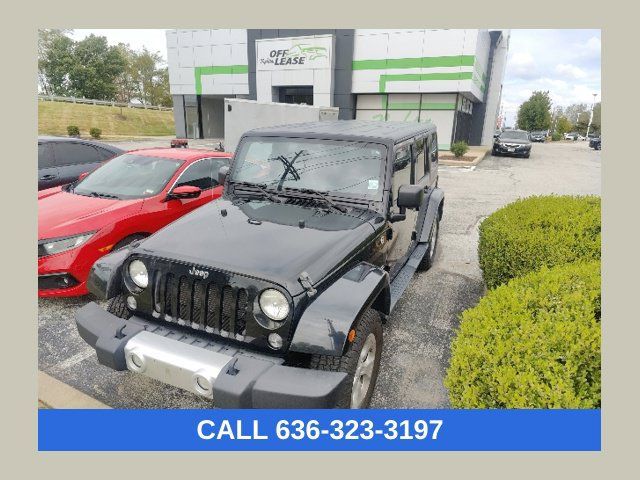 Used 2014 Jeep Wrangler Unlimited Sahara w/ Dual Top Group AWD/4WD image 1