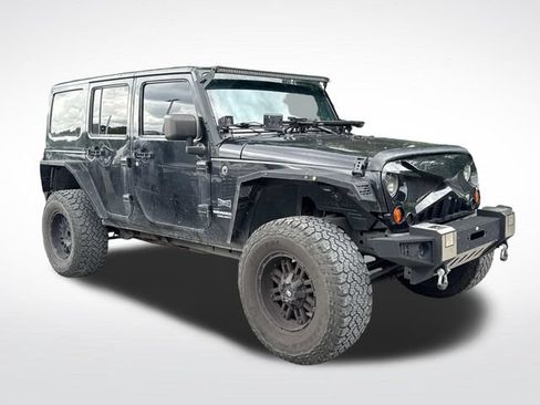 Used 2012 Jeep Wrangler Unlimited Sahara w/ Dual Top Group AWD/4WD image 9