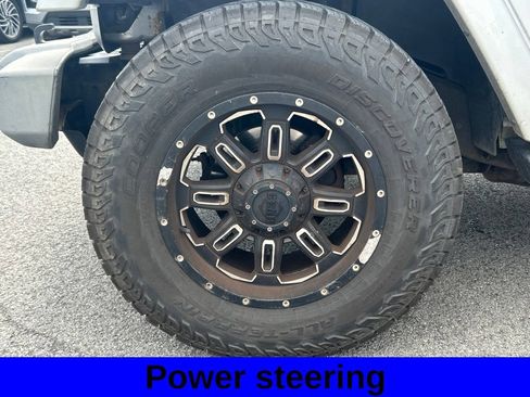 Used 2012 Jeep Wrangler Unlimited Sahara w/ Dual Top Group AWD/4WD image 9