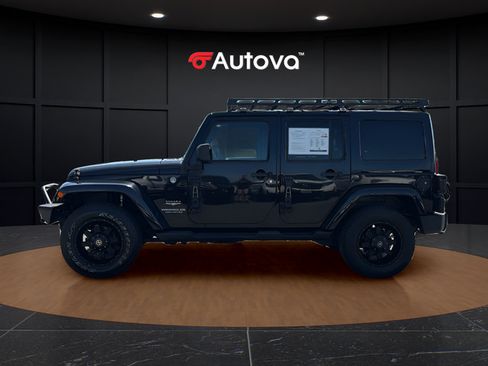 Used 2014 Jeep Wrangler Unlimited Sahara w/ Dual Top Group AWD/4WD image 2