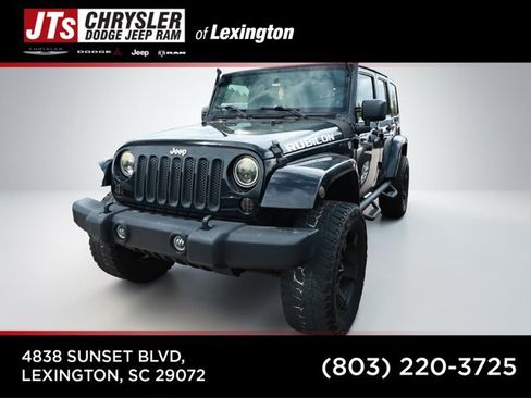 Used 2012 Jeep Wrangler Unlimited Rubicon w/ Dual Top Group AWD/4WD image 1