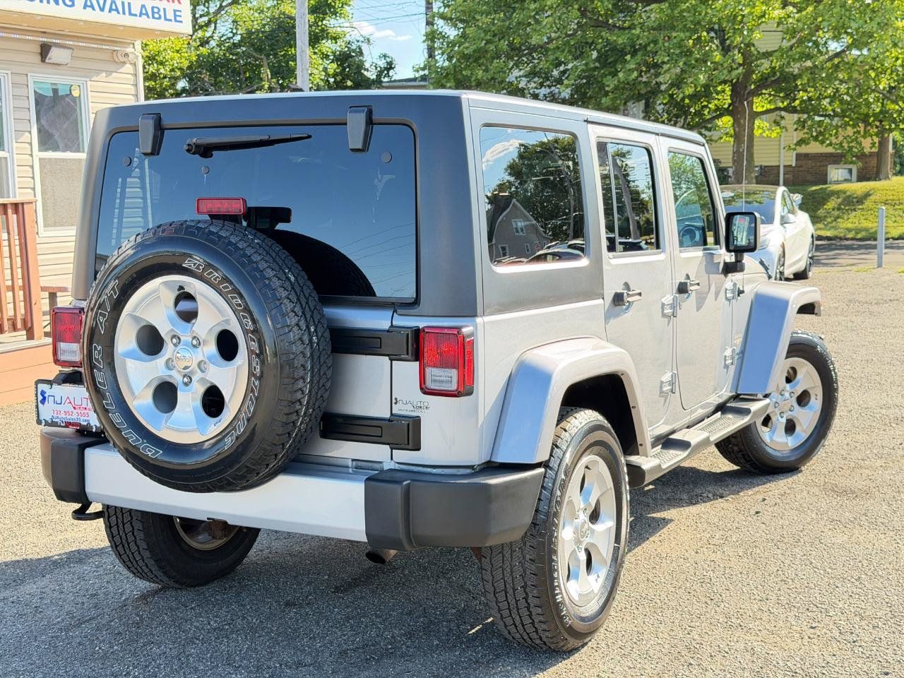 Used 2015 Jeep Wrangler Unlimited Sahara w/ Dual Top Group AWD/4WD image 78