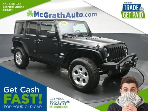 Used 2014 Jeep Wrangler Unlimited Sahara w/ Dual Top Group AWD/4WD image 1