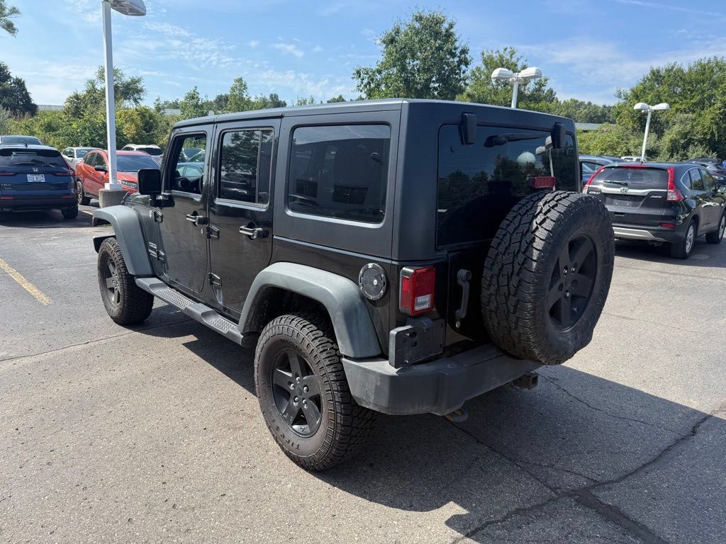 Used 2011 Jeep Wrangler Unlimited Sport w/ Trailer Tow Group AWD/4WD image 2